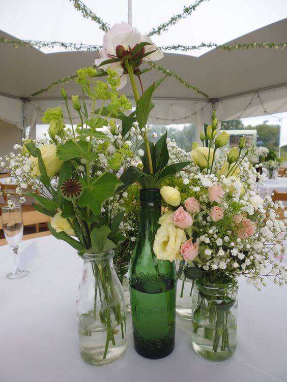 Vintage bottle wedding table flowers